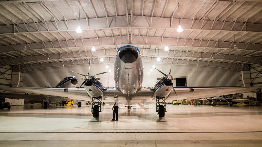 Photo of an airplane in a hangar to represent our background working with the aerospace industry